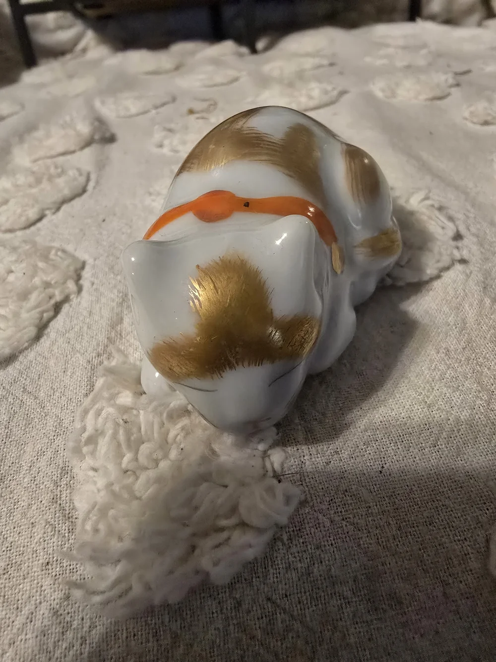 White Ceramic Sleeping Cat Figurine with Gold Accents and Orange Collar